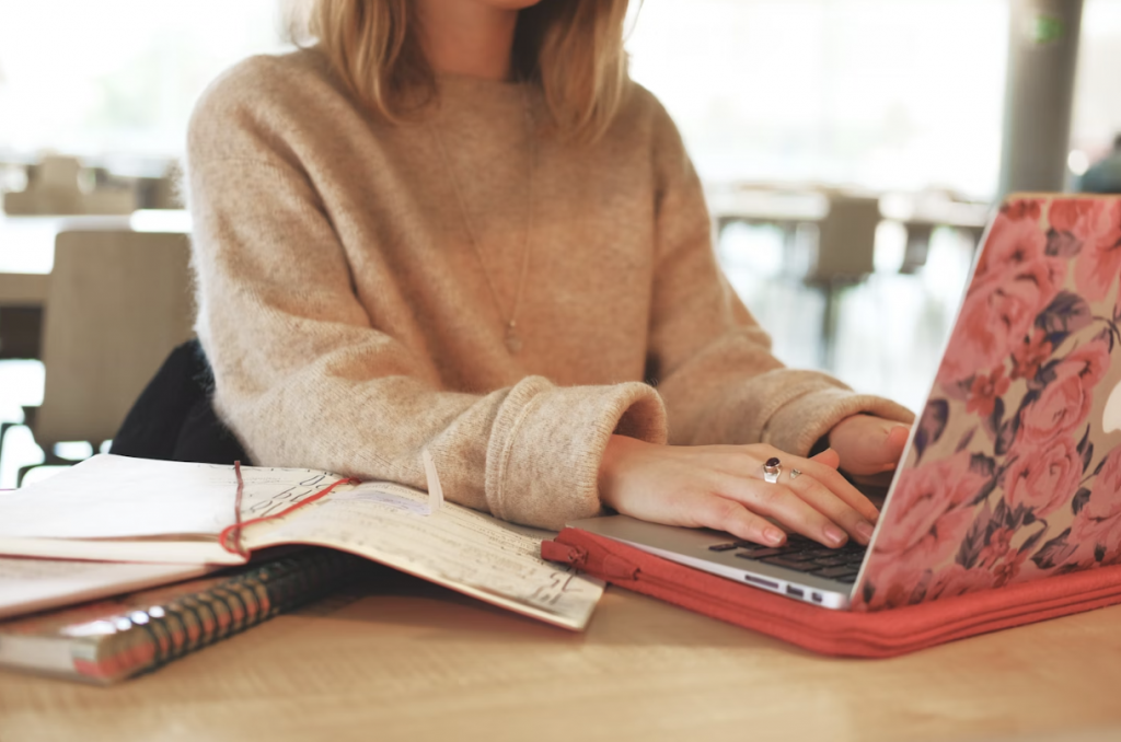 Close Up of Woman Typing on a Laptop